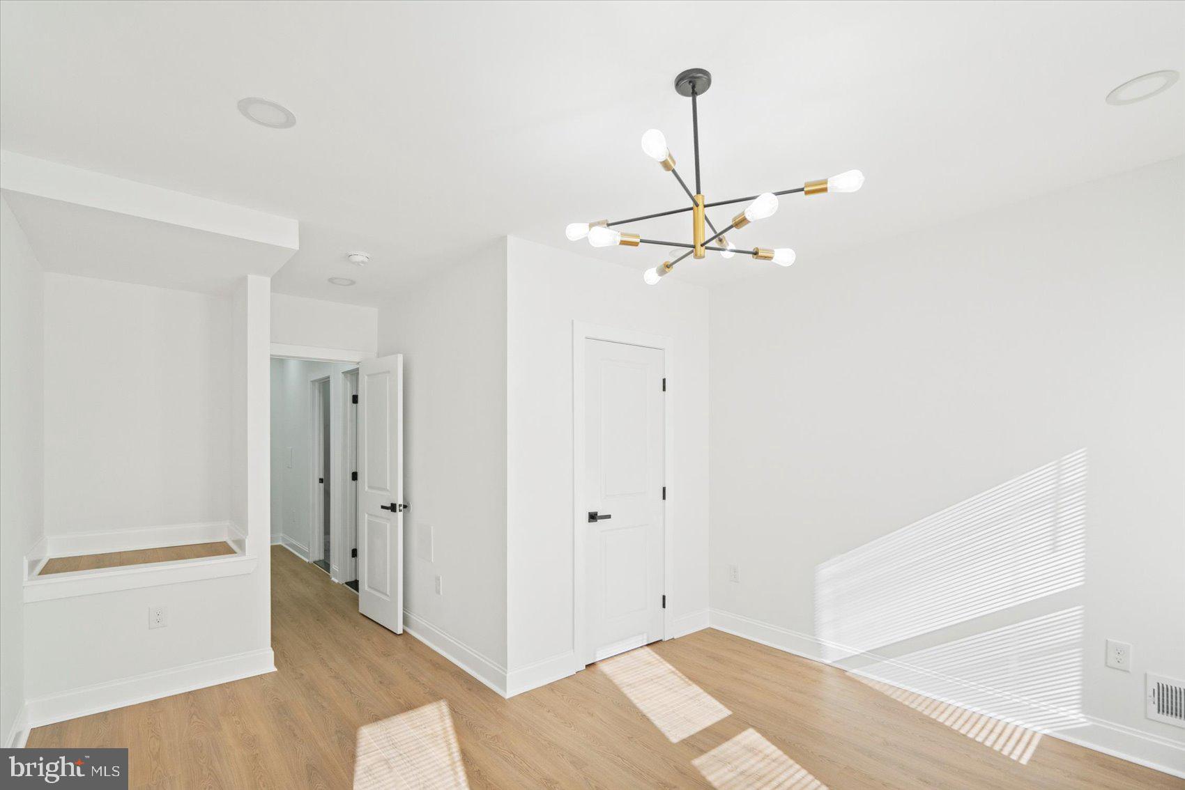 2436 East Biddle Street Baltimore, MD 21213 - Photo 22 of 33 a view of a room with a sink and a mirror