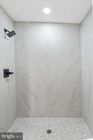 a bathroom with a toilet a sink a mirror and vanity