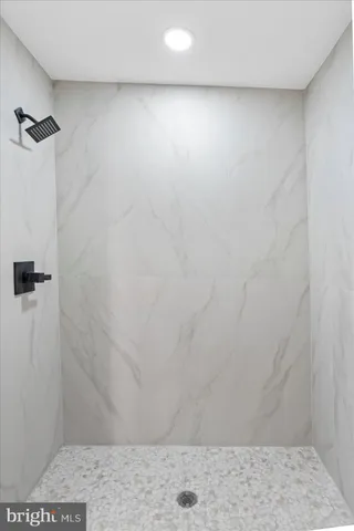 a bathroom with a toilet a sink a mirror and vanity