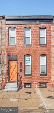a view of a brick building with many windows