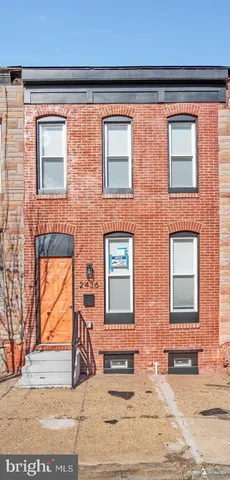 a view of a brick building with many windows