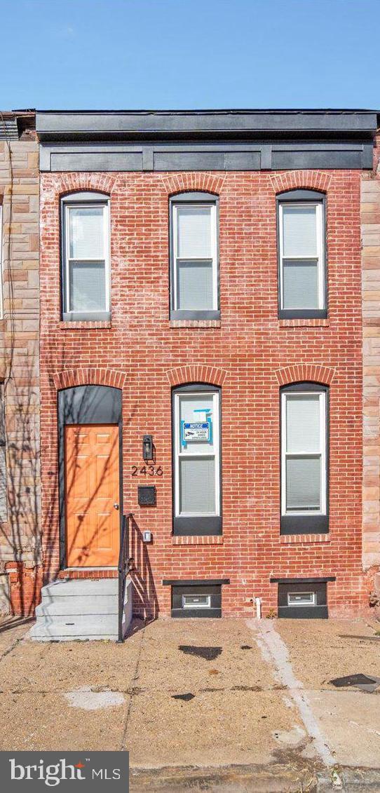 2436 East Biddle Street Baltimore, MD 21213 - Photo 29 of 33 a front view of a house with a yard