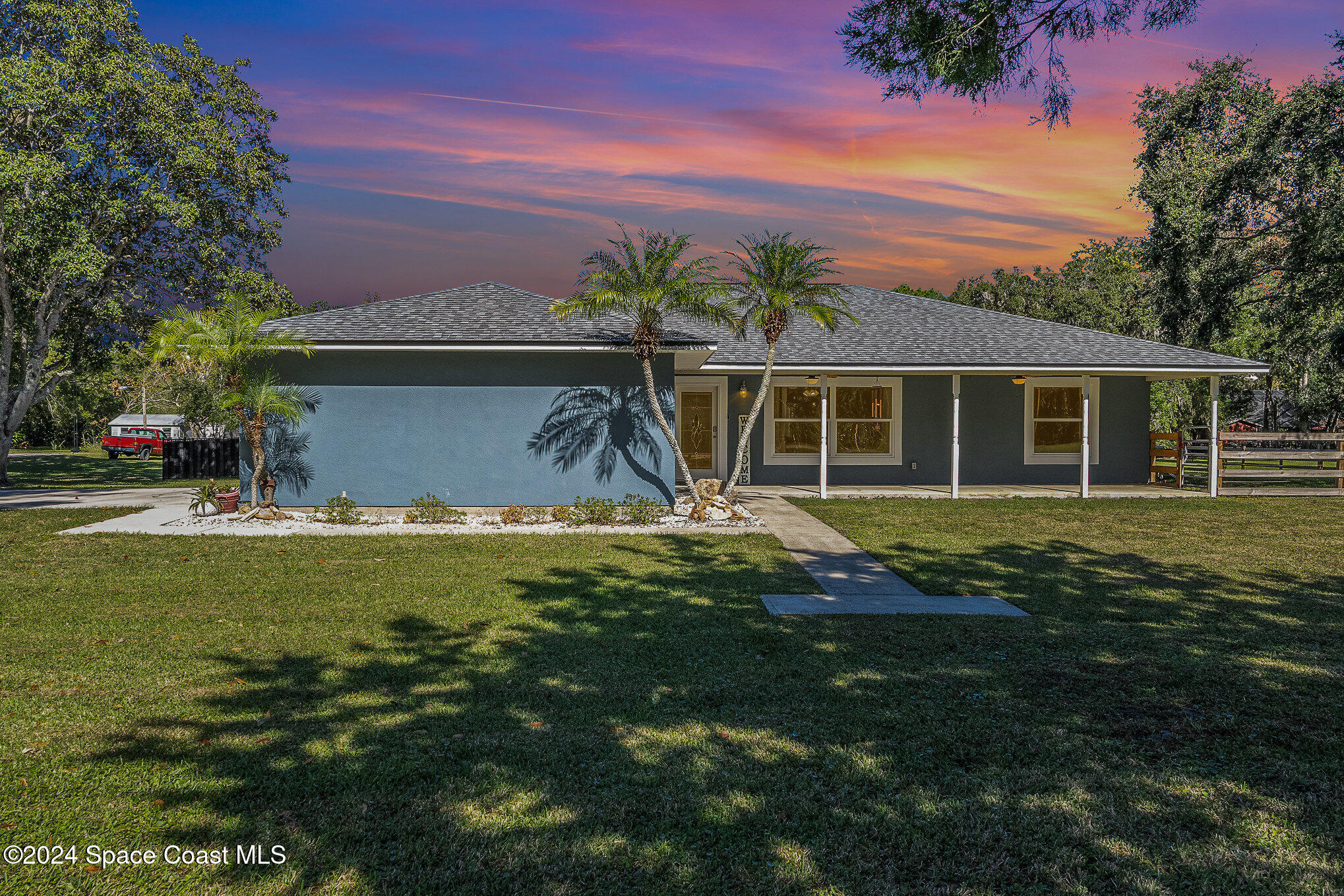 3330 Lionel Road Mims, FL 32754 - Photo 3 of 35 a view of a house with a yard