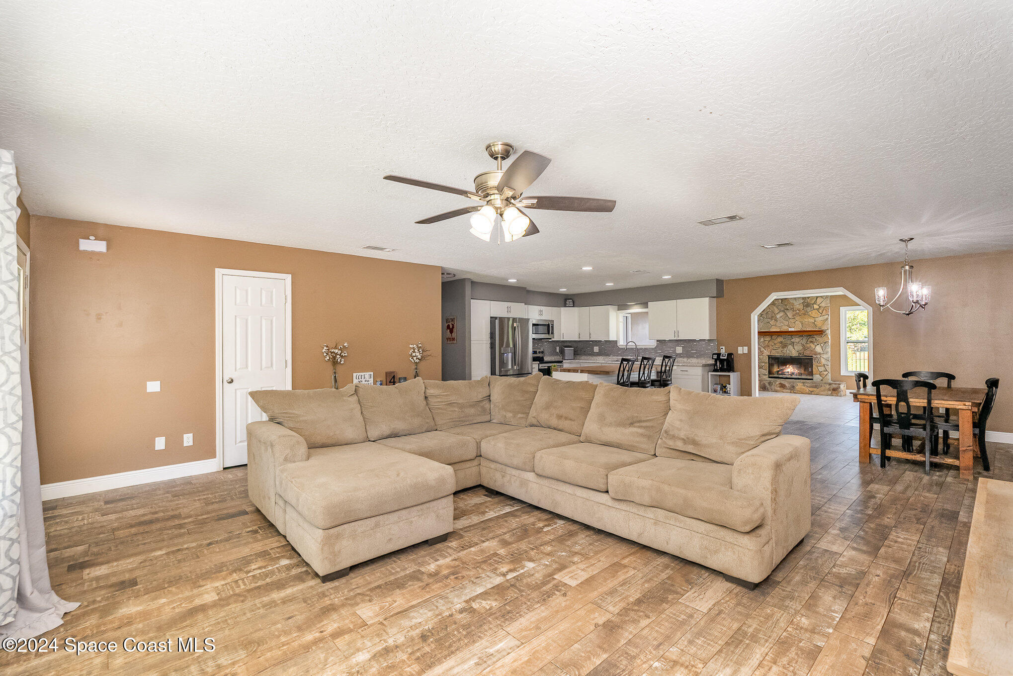 3330 Lionel Road Mims, FL 32754 - Photo 8 of 35 a living room with furniture and a large window