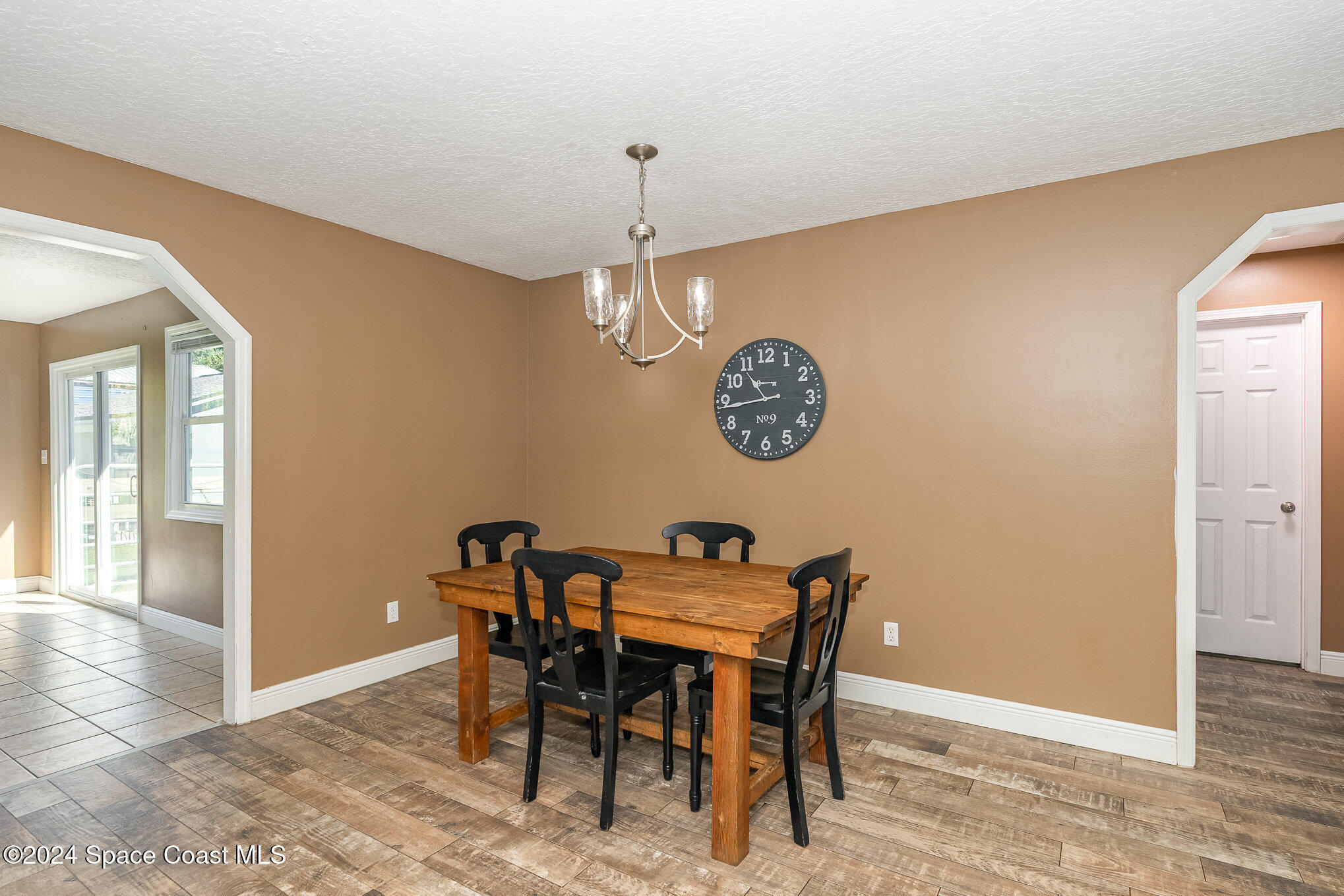 3330 Lionel Road Mims, FL 32754 - Photo 9 of 35 a view of a dining room with furniture and chandelier