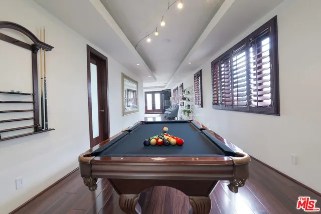 a living room with a couch and wooden floor