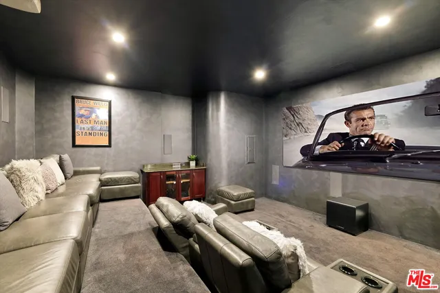 a bedroom with furniture and a wooden floor