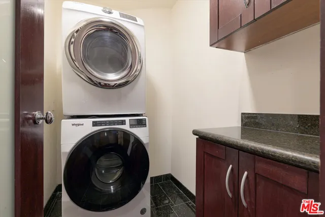 a close view of a utility room with dryer and washer