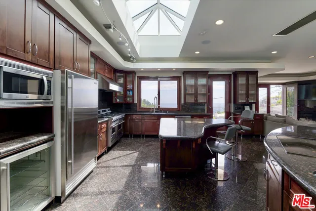 a large open kitchen with a large window