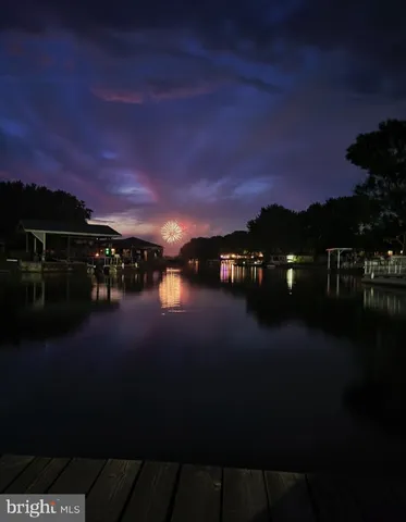 a sunset view with a lake