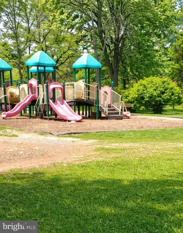a view of a swimming pool with an outdoor seating