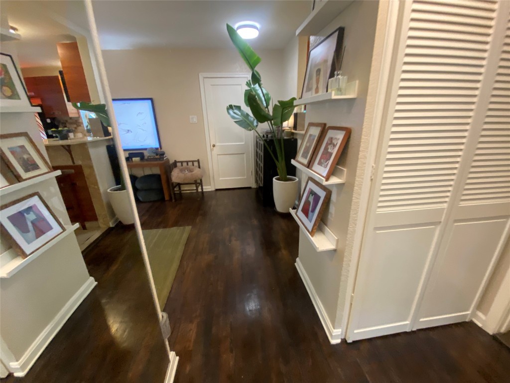 1404 West 12th Street, Unit C Austin, TX 78703 - Photo 22 of 34 a view of a livingroom with furniture and a flat screen tv