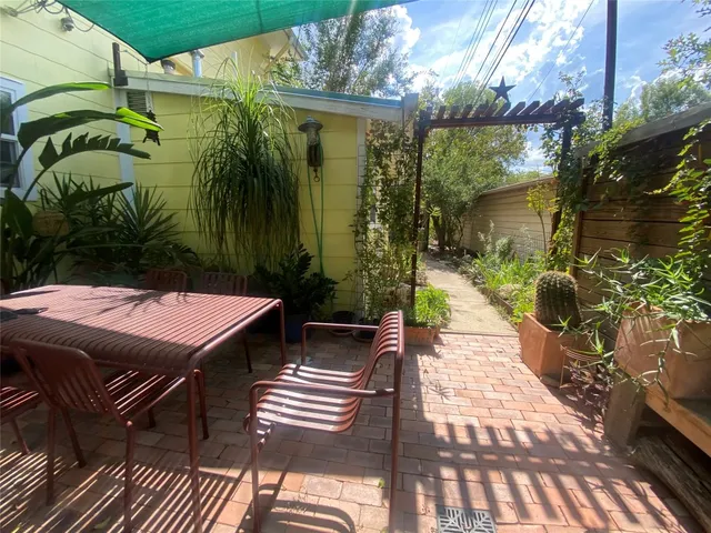 a pathway of a house with a yard