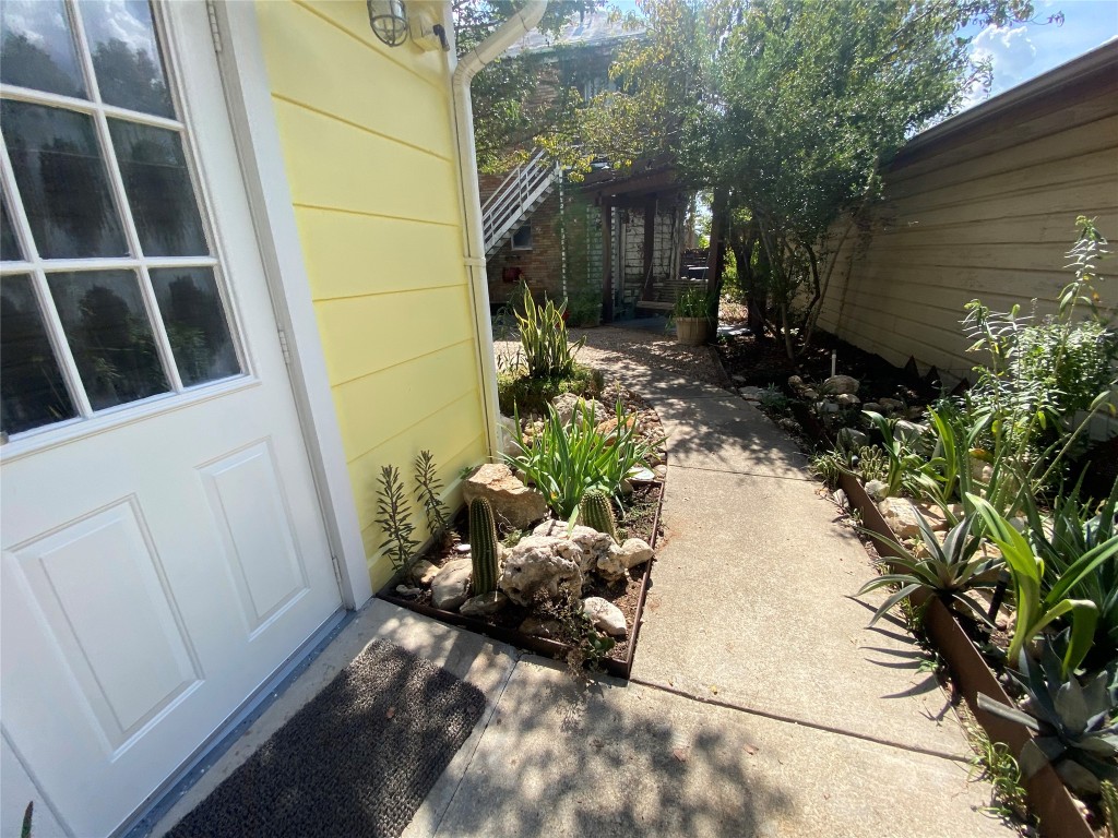 1404 West 12th Street, Unit C Austin, TX 78703 - Photo 30 of 34 a view of a back yard of the house