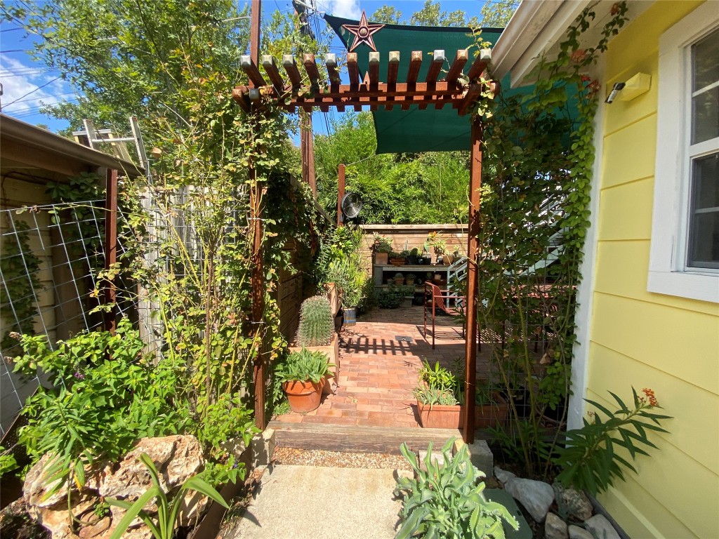 1404 West 12th Street, Unit C Austin, TX 78703 - Photo 31 of 34 a pathway of a house with a yard