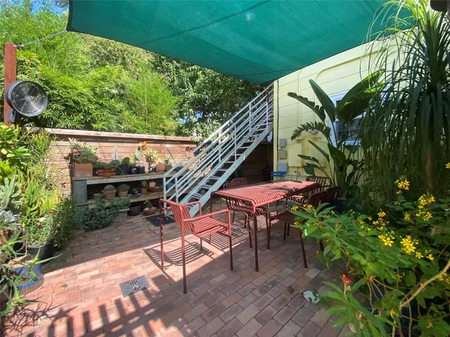 a view of a backyard with sitting area