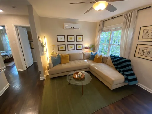 a dining room with table chairs and a flat screen tv
