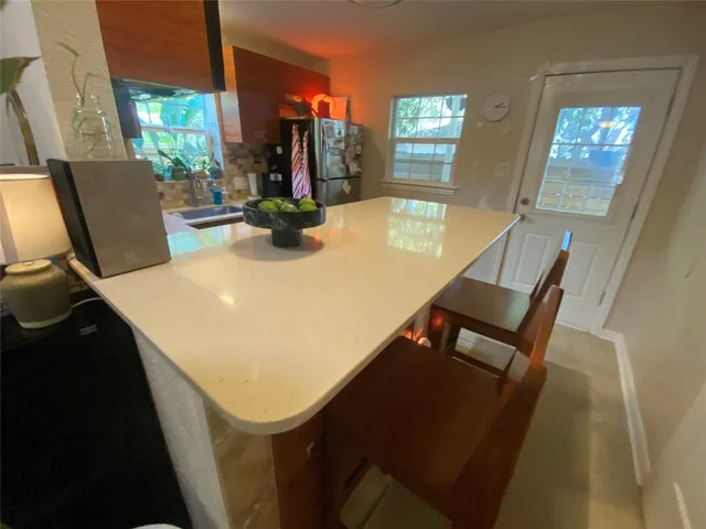 a kitchen with a sink appliances and cabinets