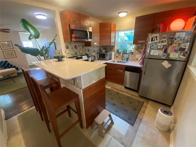 a kitchen with a stove and a microwave