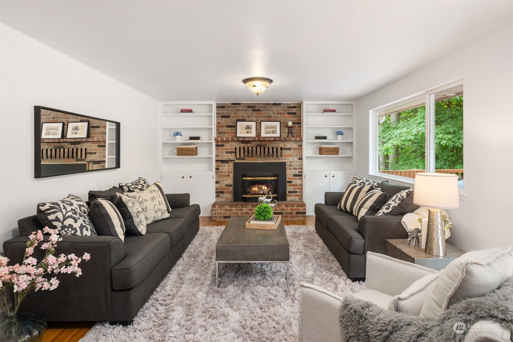9523 Northeast 198th Street Bothell, WA 98011 - Photo 11 of 39 a living room with furniture fireplace and window