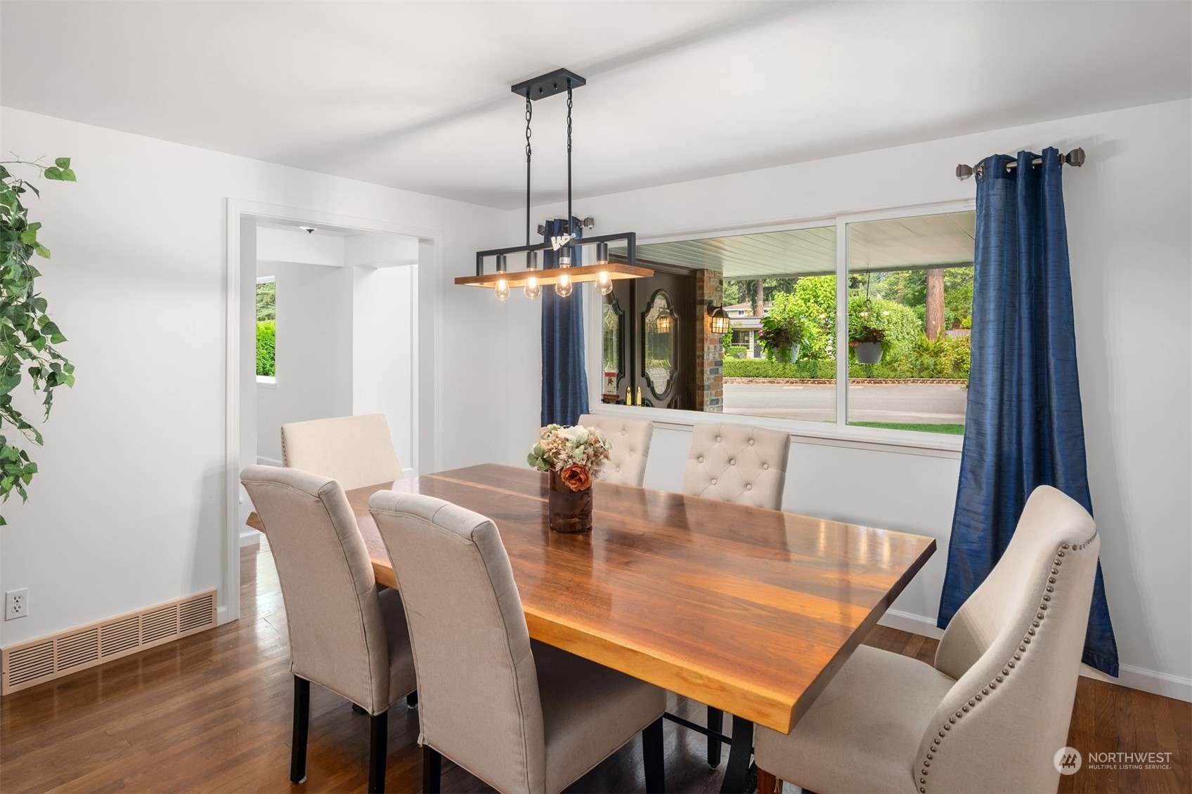 9523 Northeast 198th Street Bothell, WA 98011 - Photo 13 of 39 a view of a dining room with furniture window and wooden floor