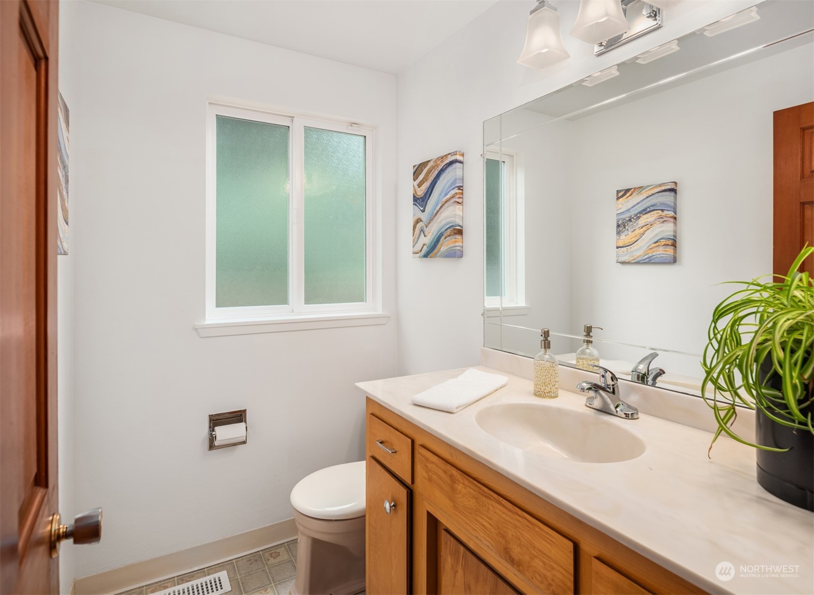 9523 Northeast 198th Street Bothell, WA 98011 - Photo 14 of 39 a bathroom with a sink and a mirror
