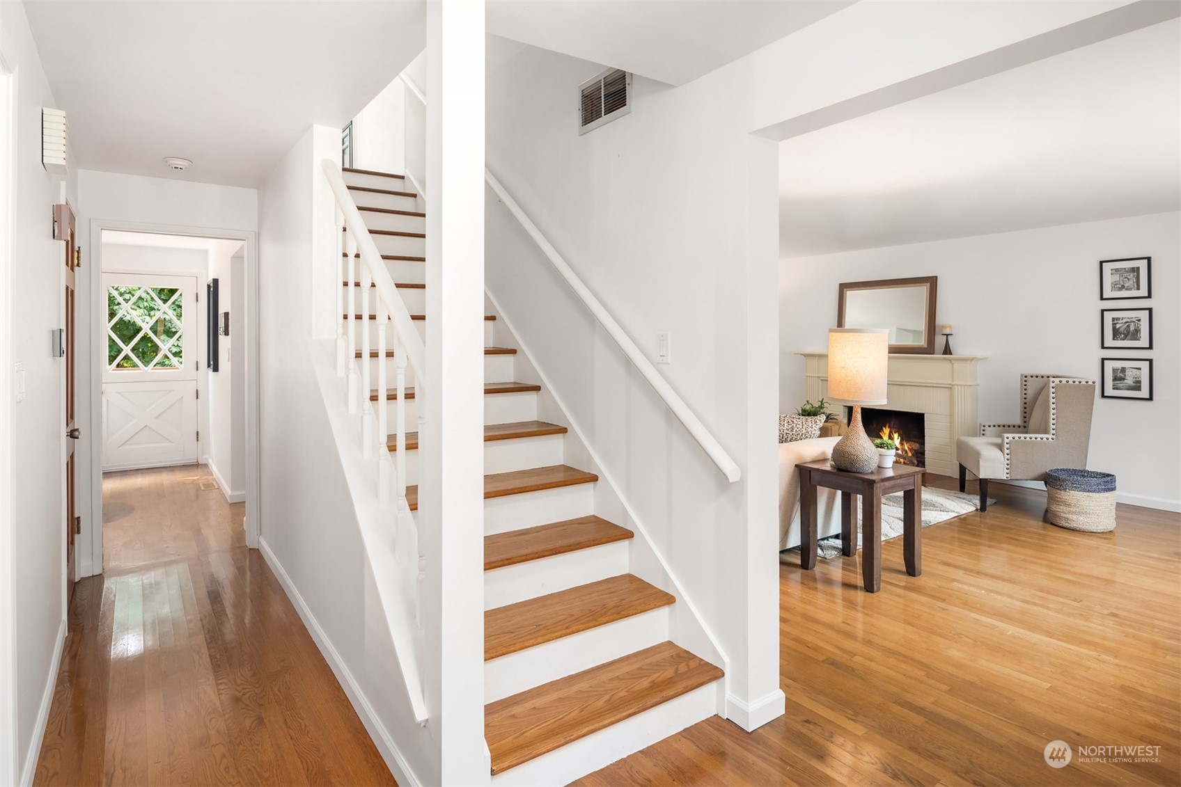 9523 Northeast 198th Street Bothell, WA 98011 - Photo 15 of 39 a view of a hallway with wooden floor and staircase