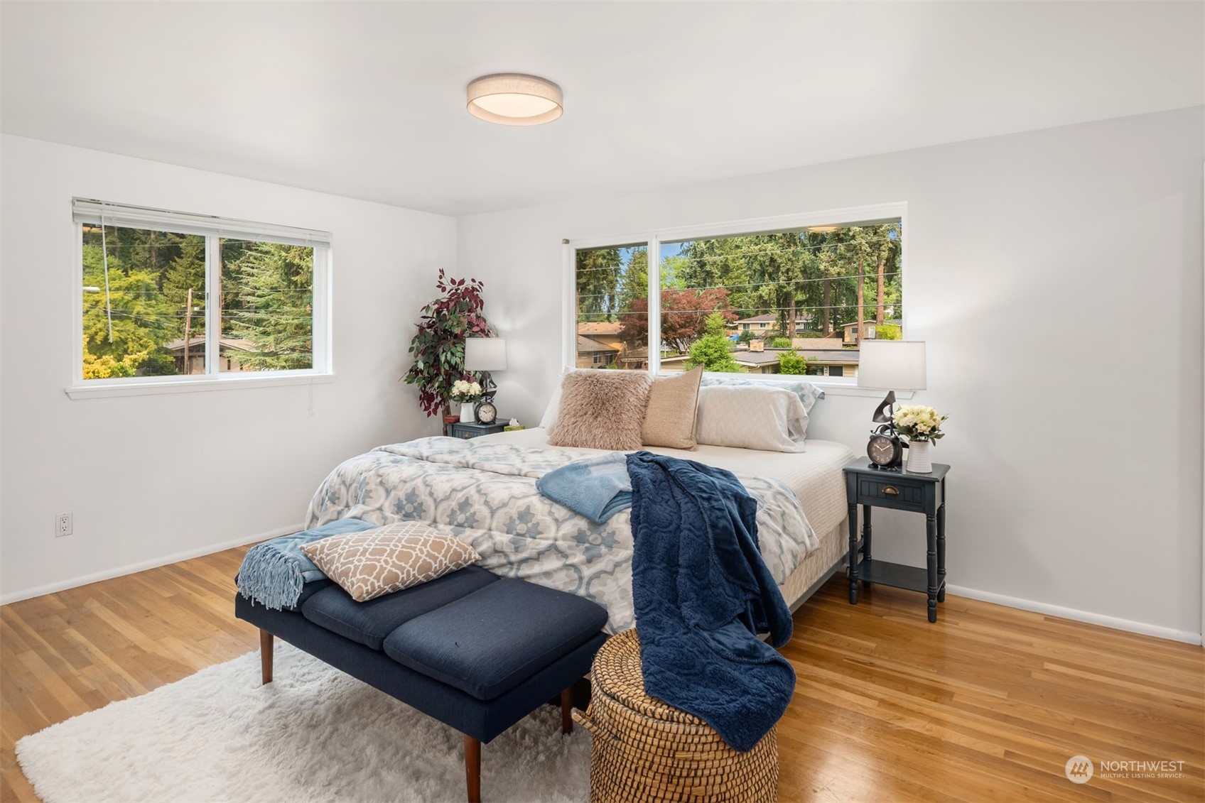 9523 Northeast 198th Street Bothell, WA 98011 - Photo 16 of 39 a bed sitting in a bedroom next to a window