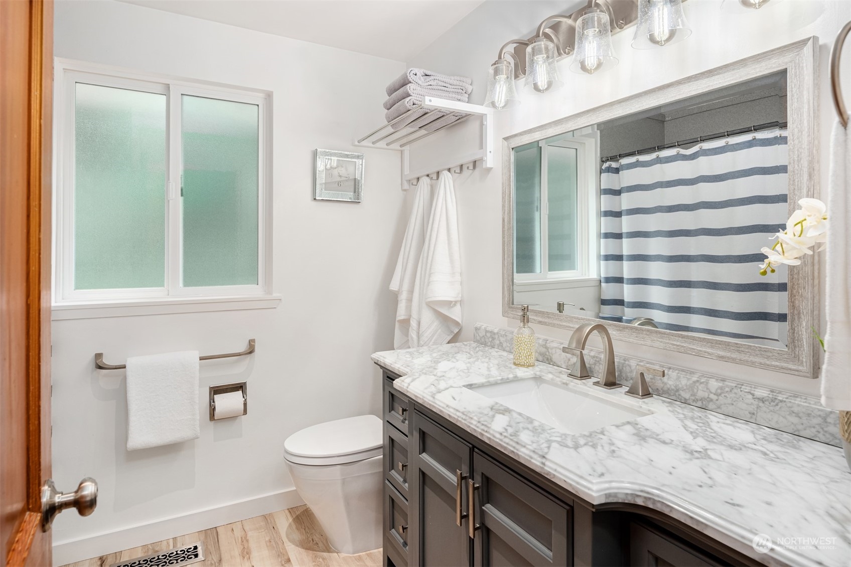 9523 Northeast 198th Street Bothell, WA 98011 - Photo 17 of 39 a bathroom with a granite countertop sink toilet and shower
