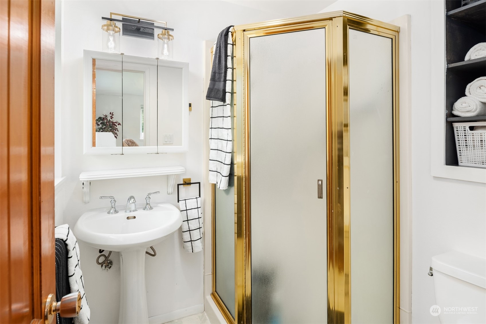 9523 Northeast 198th Street Bothell, WA 98011 - Photo 19 of 39 a bathroom with a sink and a mirror