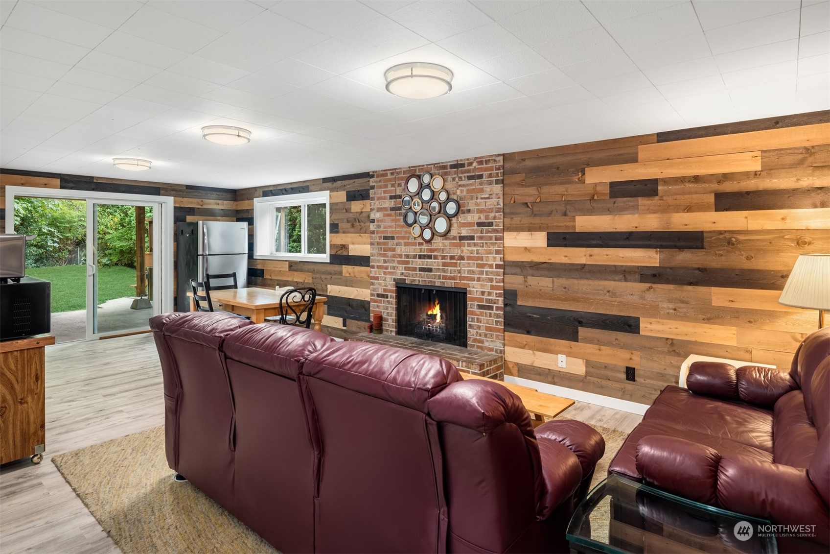 9523 Northeast 198th Street Bothell, WA 98011 - Photo 23 of 39 a living room with furniture and a fireplace