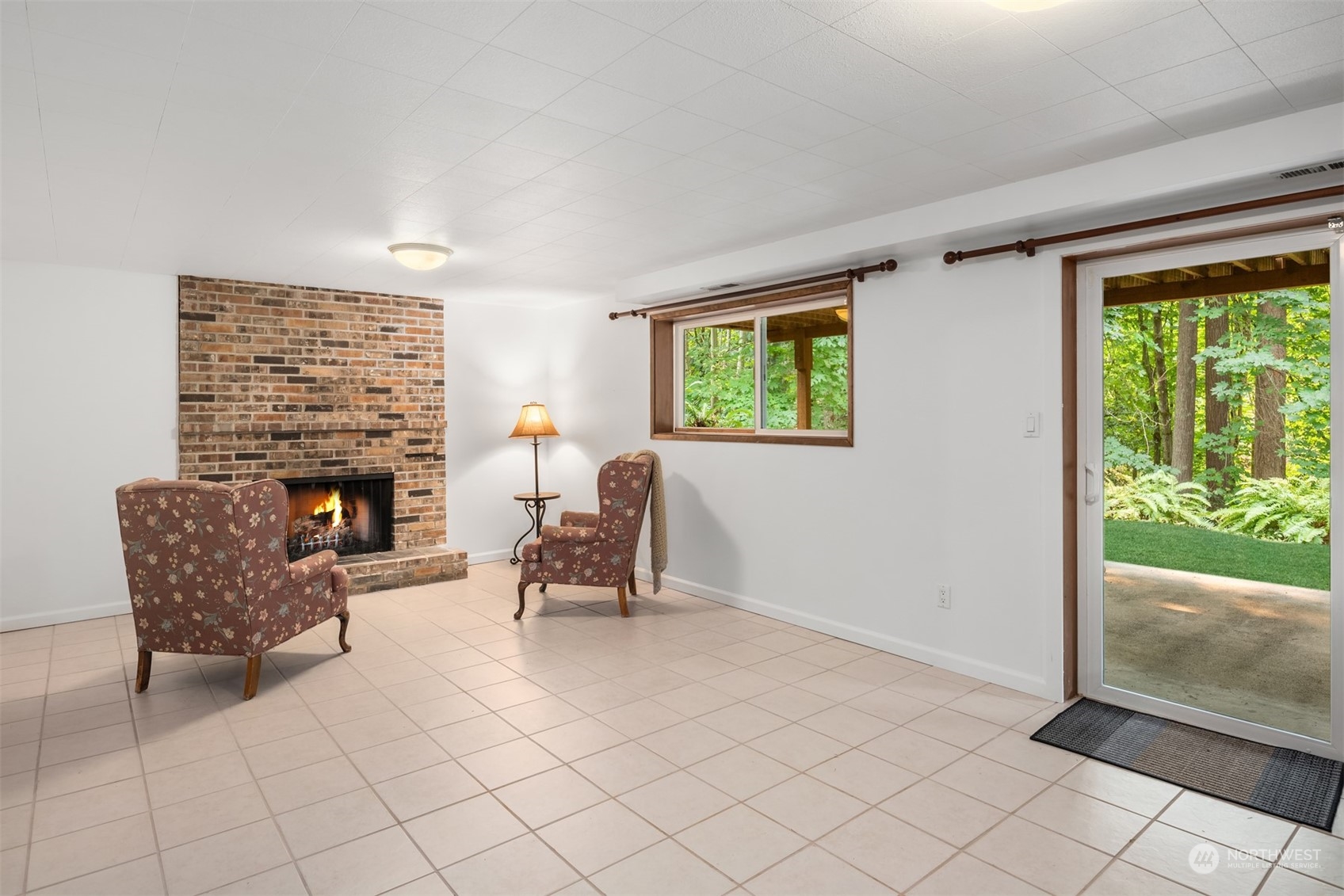 9523 Northeast 198th Street Bothell, WA 98011 - Photo 26 of 39 a living room with furniture and a fireplace