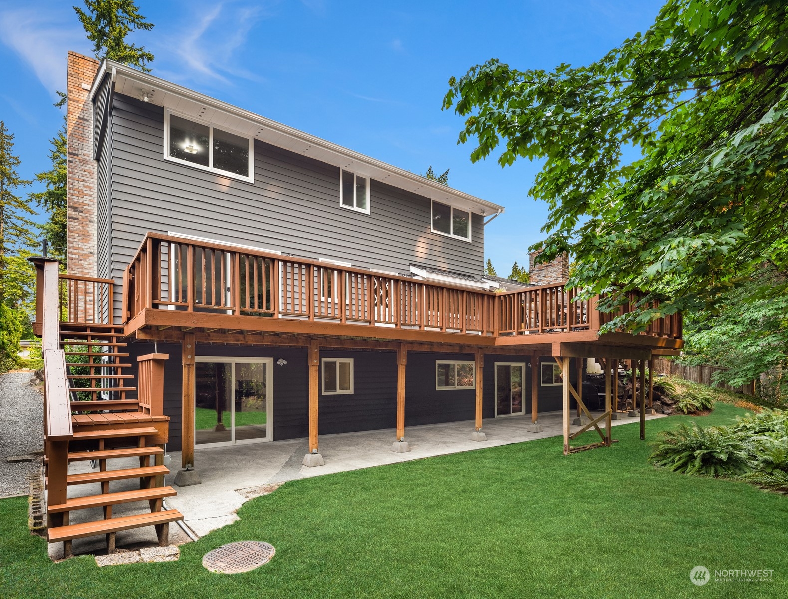 9523 Northeast 198th Street Bothell, WA 98011 - Photo 31 of 39 a view of a house with a yard porch and sitting area