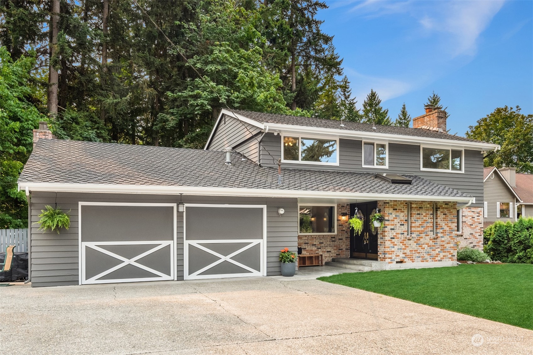 9523 Northeast 198th Street Bothell, WA 98011 - Photo 39 of 39 a front view of a house with a yard and garage