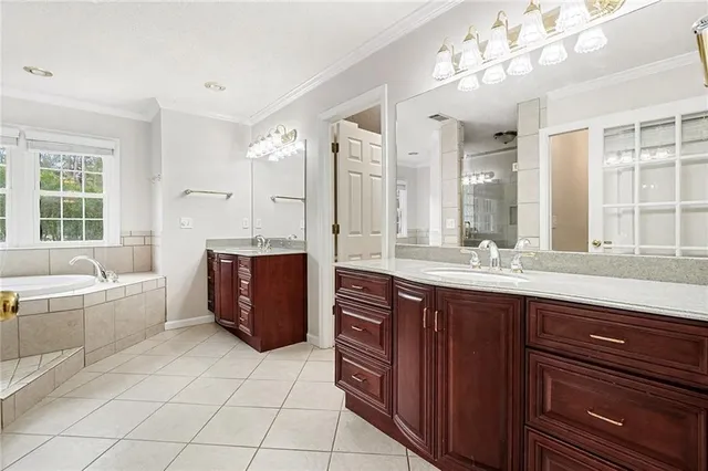 a bath room with a bath tub and a shower