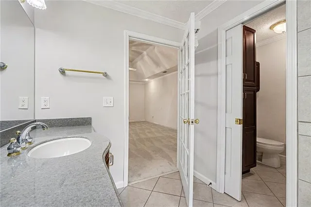 a view of staircase with railing and white walls
