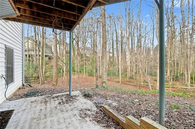 a view of a tall building in the forest