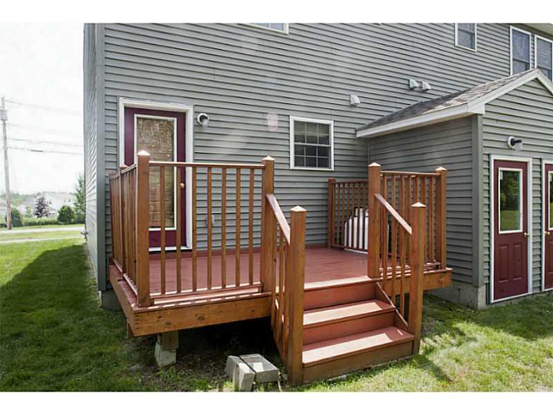 199 Bomarc Road, Unit 18 Bangor, ME 04401 - Photo 3 of 24 Exterior Back. Backyard deck off kitchen
