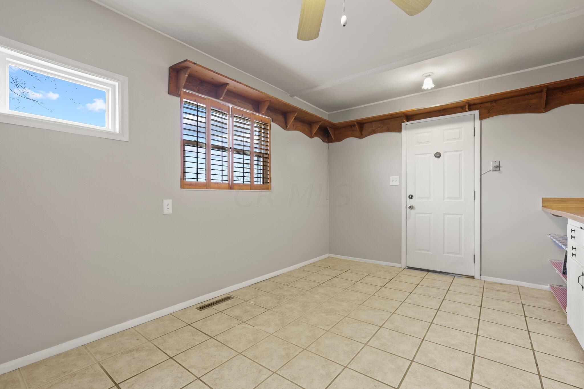 1493 Watkins Road Columbus, OH 43207 - Photo 12 of 21 Rear door that opens to the carport area.