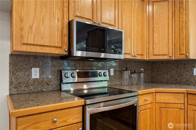 a kitchen with a stove and a microwave
