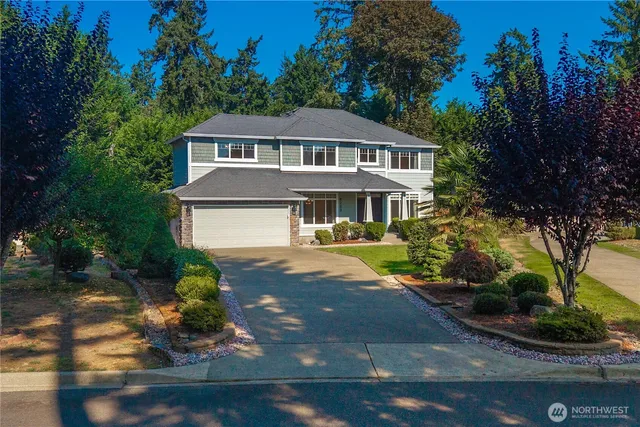 a front view of a house with yard