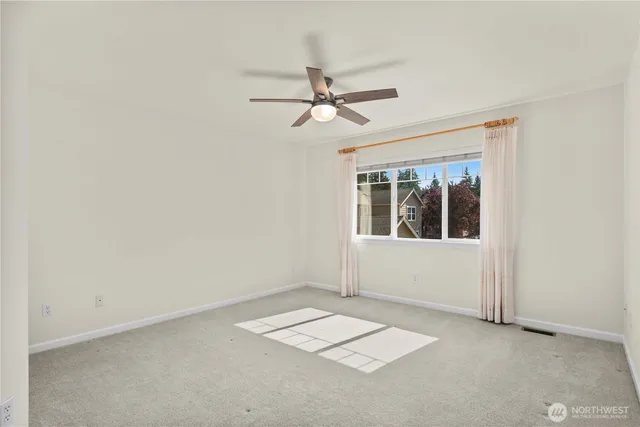 a spacious bathroom with a tub sink shower and mirror