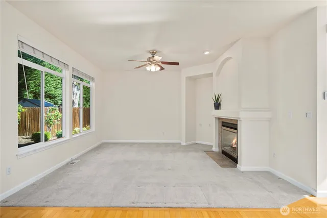 a view of livingroom with furniture hardwood floor and ceiling fan