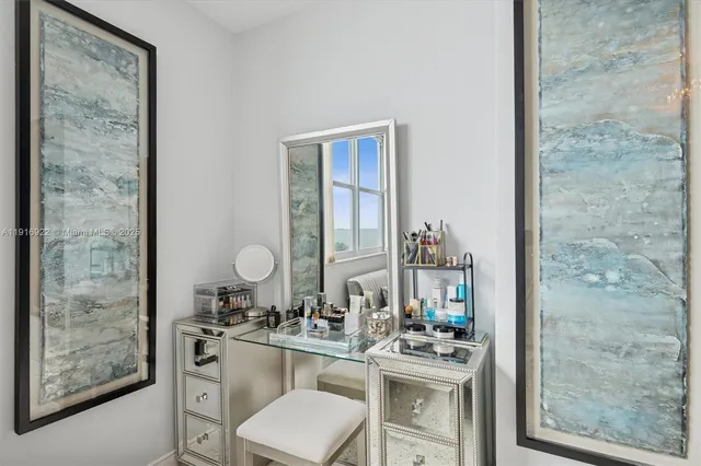 a room with a sink and a mirror