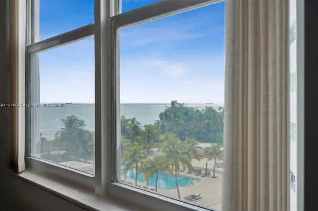 a view of a room that has a large window