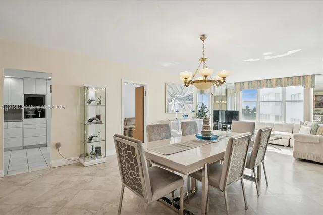 a dining room with furniture window and outdoor space