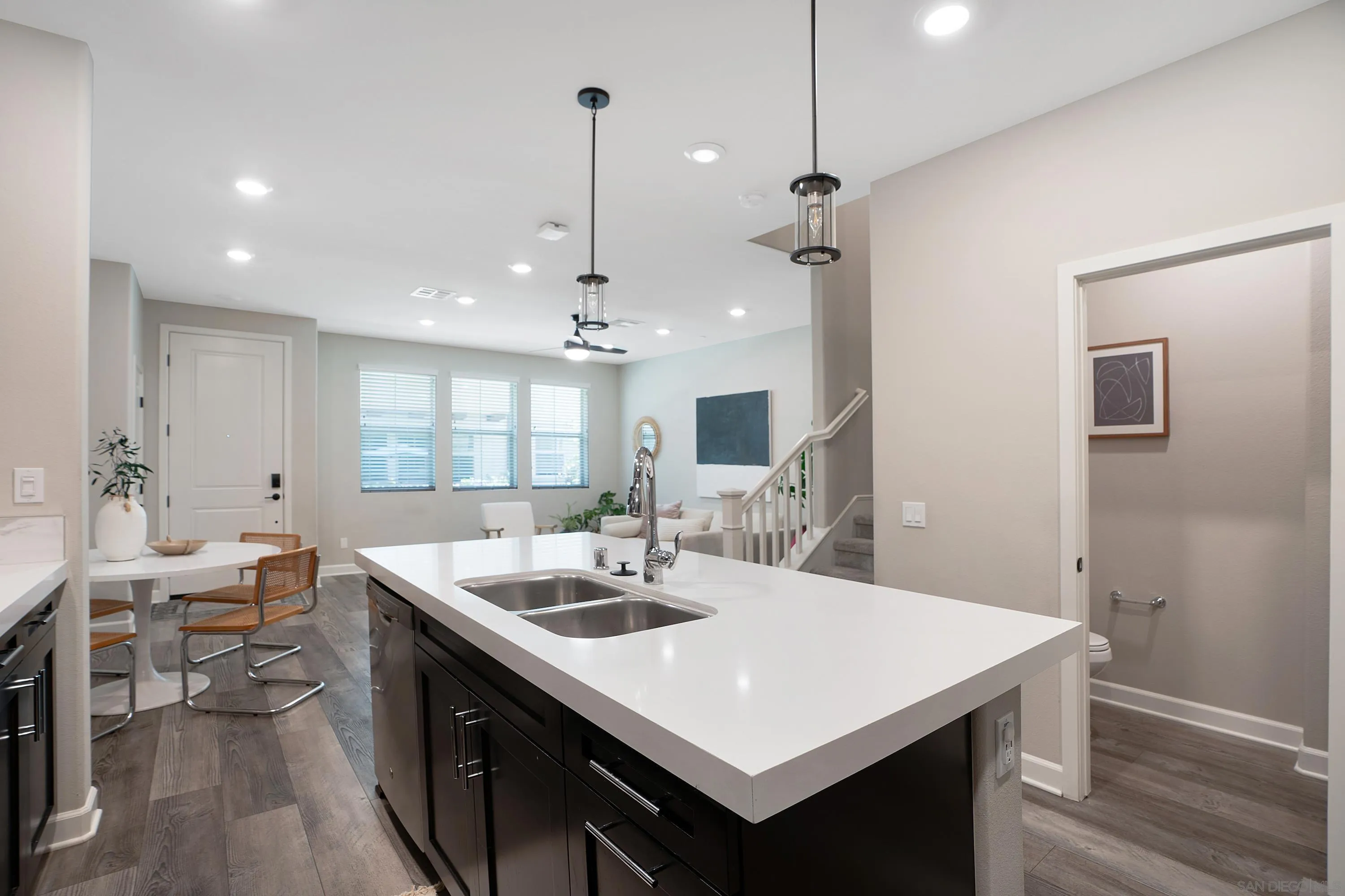 1172 Delpy View Point Vista, CA 92084 - Photo 10 of 29 a kitchen with center island table and chairs
