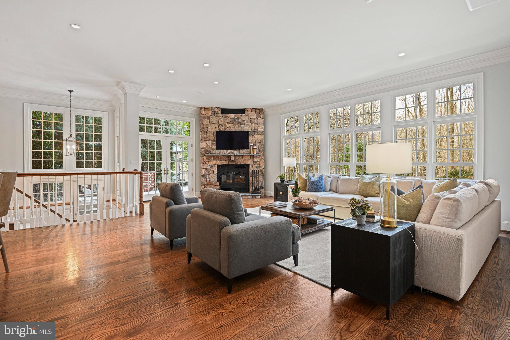 1064 Silent Ridge Court McLean, VA 22102 - Photo 12 of 70 a living room with furniture fireplace and a large window