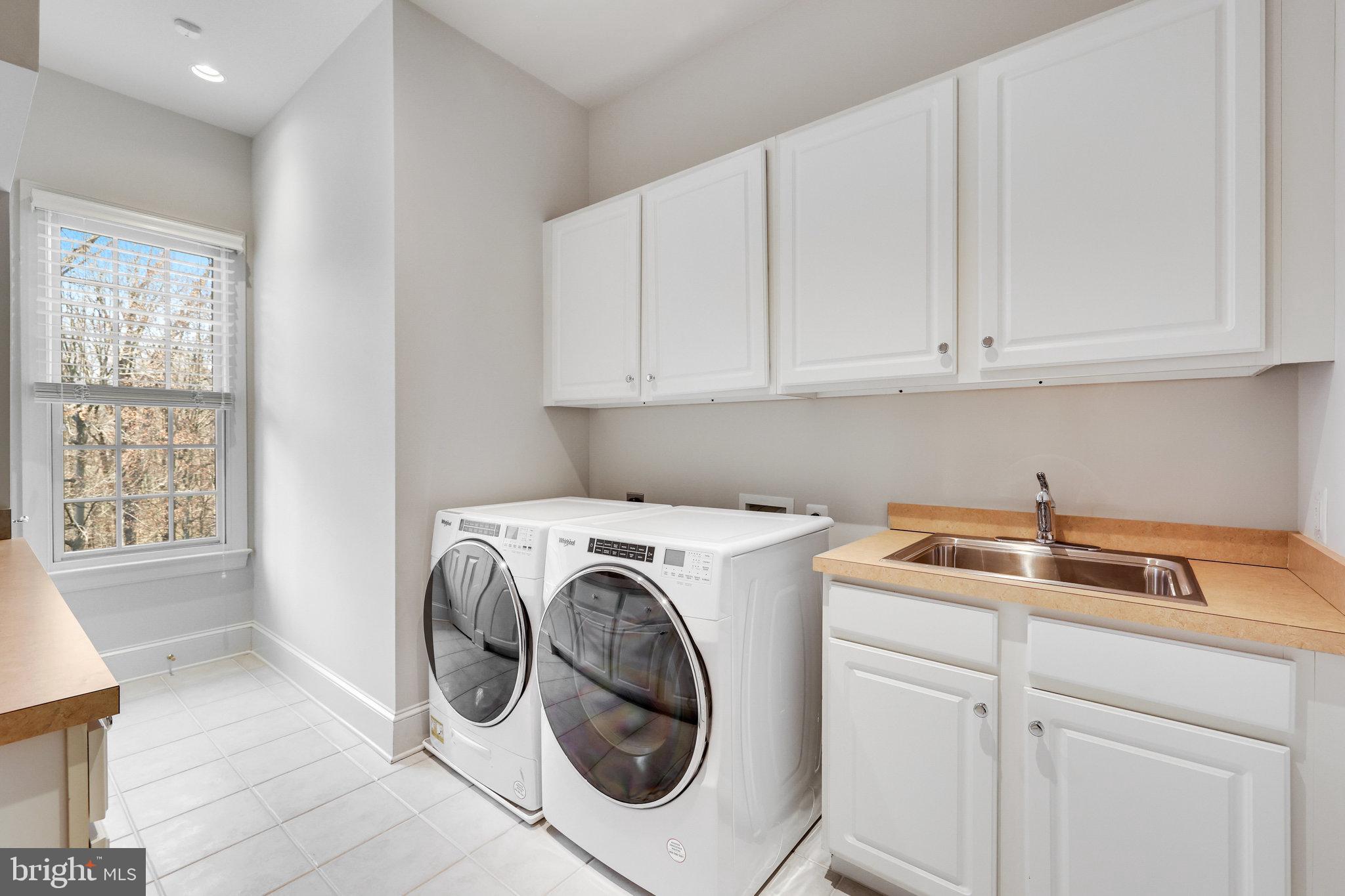1064 Silent Ridge Court McLean, VA 22102 - Photo 32 of 70 a utility room with dryer and washer