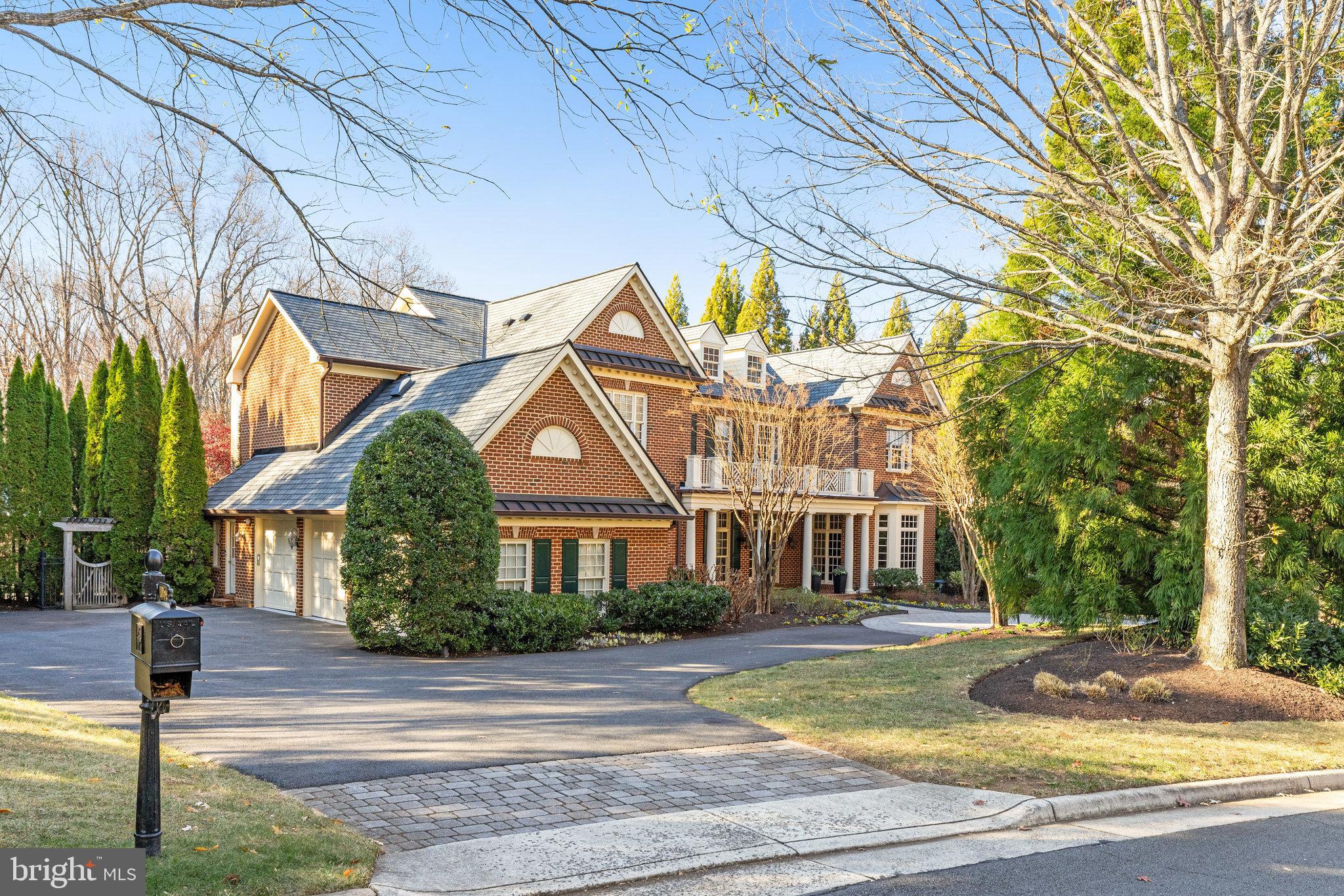 1064 Silent Ridge Court McLean, VA 22102 - Photo 4 of 70 a front view of a house with garden and trees